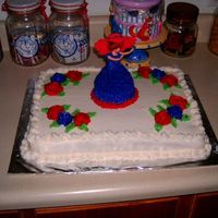 Red Hatter For The Red Hat Rodeo White sheetcake with white buttercream icing. Red and Purple colors of the Red Hat Society for the miniature doll cake and roses.