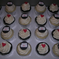 Nurse Cupcakes my best friend is a nurse and requested i make cupcakes for her to bring to the hospital. decorated with fondant hearts and nurse hats.
