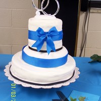 With This Ring I Thee Wed Wedding Cake I made as a gift to my cousin & her husband. Each layer was a different flavor, Red Velvet, Lemon Pound, & Reese'...