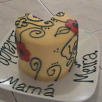 Just Because I Had Extra Batter And Frosting :-) I made this small cake with the extras I got from a Mickey cake. WASC, blackberry filling, buttercream frosting and flowers in fondant.