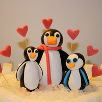 Penguin Birthday Cake This is the topper I made for my daughter's 7th birthday cake. She loves penguins! These are modeled after her three stuffed ones. She...