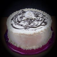 1Whiterosecake001.jpg All butter cream cake with chocolate mouse filling.