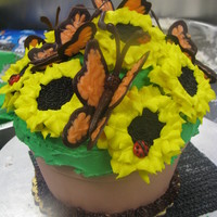 Flower Pot I made a jumbo cupcake look like a flowerpot, added some chocolate butterflies and oreo sunflowers.