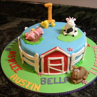 Barnyard 1St Birthday Cake This cake was made for a Mother's Group 1st Birthday. The cake board is decorated with all the kid's names.