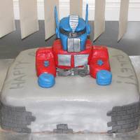 Optimus Prime My son asked for a Optimus Prime cake for his 6th Birthday. After looking at other OP cakes on here I got a few ideas. The cake is vanilla...