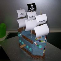 Pirate Cake This cake was made for one of my sons when he turned 4. It's entirely covered in BC and decorated with jelly bellys and curly wurlys....