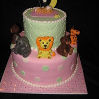 Baby Shower Cake With A Animal Theme 10,6' wasc baby and all animals were from gumpaste, first time I used my baby mold, I was so excited and it was soooo easy to use.