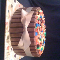 Kit Kat Barrell Cake red velvet cake....with kit kats and m & m's. took this cake to my family reunion. have been wanting to do one since I saw it on...
