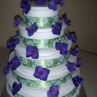Green And Purple Wedding Cake First real time I did this many swags on a cake.Glad to have that done and over with. The overall look was great.I brushed 5 coats of dust...