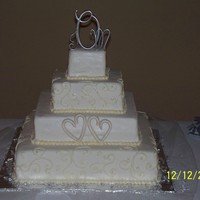 First Fondant Wedding Cake this is only my 2nd wedding cake and my first fondant wedding cake....so i think it turned out pretty good. all MMF with buttercream...