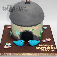 Bird House This cake was made for a Mother's Day celebration at a local retirement home. Everything is edible. Bottom is 3 - 8" rounds, I...