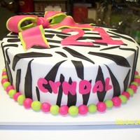 21 Zebra buttercream w/ fondant zebra stripes and bow.