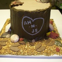 Tree Stump Cake was to replicate how the wedding couple met while hunting. Both are big hunters. buttercream on "stump", fondant leaves and...