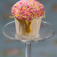 Sprinkle Cupcake With Gold Bunny A simple mini with pearlised non pareils and a gold gumpaste bunny, to match my trading name.