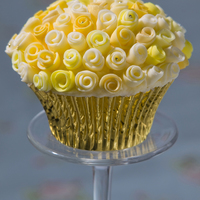Gold Roses A vanilla cupcake with vanilla buttercream, 60+ hand rolled roses some studded with 1mm gold dragees and some with gold lustre dust.