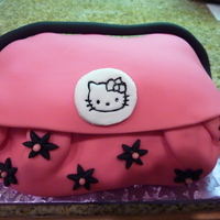 Hello Kitty Birthday Purse Cake My daughter asked me to PLEASE make her a Hello Kitty Purse cake. She absolutely loved it!