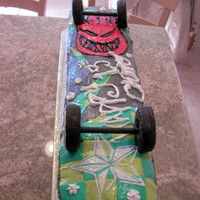 Skateboard Cake Measured to match regulation size skateboard. Weighed about 9lbs! Consisted of 4 rectangular cakes and 2 square. Marshmallow fondant for...