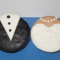 Wedding Cupcakes yellow cupcake iced in buttercream and covered in MMF. Dragees for the necklace.