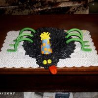 Party Spider the cake is covered in buttercream and the legs, hat and tongue are fondant