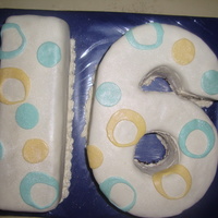 Sweet Sixteen Chocolate cake /w mmf and dusted with pearl dust. I had real problems covering the six and ended up not covering the hole and the inside of...