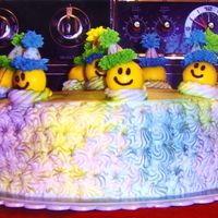 Smiley Face Cake the smiley faces are chocolate /w fondant and royal icing hats. The cake is covered in butter cream