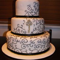 My Very First Wedding Cake This is my first wedding cake. The design was inspired by a key graphic on the wedding invitations. It was Dark Choc mud cake with cherry...