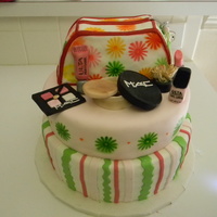 Make Up Purse, 10" MARBLE CAKE WITH DULCE DE LECHE AND BUTTERCREAM, 8" VANILLA WITH CHOCOLATE FILLING. PURSE IS MARBLE CAKE COVER WITH MMF THE...