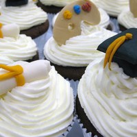 Graduation Cupcakes Devils Foodcake chocolate cupcakes with home-made buttercream. Graduation caps, diplomas and artist palettes are all gumpaste.