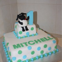 Happy 1St Birthday Mitchell Timmy Time CakeWhite Chocolate Mud cake covered in fondantTimmy made from fondantMade by Jess & Deb