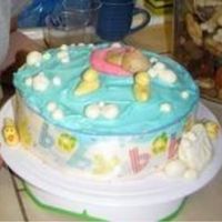 Duckie Baby Shower Cake I made this for my sister Cameo's Baby Shower. It was a 4 layer Vanilla Cake with Pastry Cream & Fresh Strawberries in Vanilla...