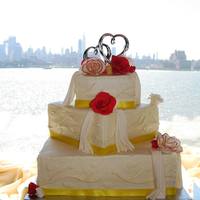 D&b Wedding Cake 12-8-5 inch cake for an afternoon brunch wedding. French Vanilla WASC with a chocolate-raspberry mousse filling. BC with fondant draping,...