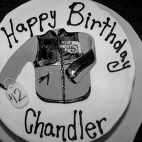 The North Face Jacket Cake I get really weird cake requests! Fondant jacket--painted black parts.