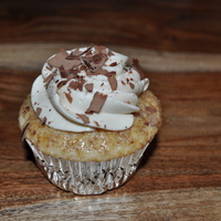 Tiramisu Cupcake Made for the adults at my son Logan's 5th birthday. Sweet Italian Vanilla cream cupcake with a coffee liquer glaze filled and frosted...