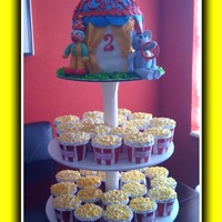 Circus Tent & Popcorn Cupcakes I did this for my son's 2nd birthday which was circus themed. clown and elephant made of fondant. tent is 6 inch carved to look like a...