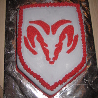 Dodge Ram Cake Covered in grey MMF and the logo is buttercream.
