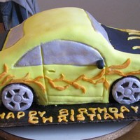 Christian's Car My first attempt at sculpting a car cake. My grandson loved it !!!