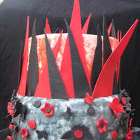 Graduation Cake This cake was made for a high school graduation cake. The client asked for something with red and black and "artsy." I saw an...