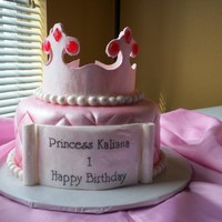 Princess Cake Gum paste crown, gum paste scroll, chocolate cake with raspberry filling, Duff' fondant and lots of disco dust.