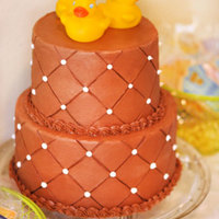 Baby Shower Cake Chocolate cake, filled with alternating layers of chocolate ganache and cheese cake, chocolate buttercream frosting. Yummmmm. For my...