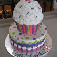 Olivia This cake was for a friend's daughter. 12" bottom, the cupcake is carved from stacked 8".