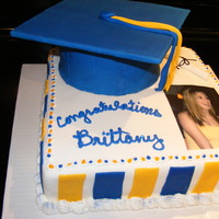 High School Graduation cap is cake covered in fondant, mortarboard is cardboard covered in fondant, tassel is fondant and gum paste mix.