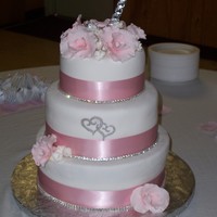 Pretty In Pink Pink orchids and satin ribbon. Crystal trim. I really thought this cake was pretty until I had to add the heart cut out (cricut cake) that...