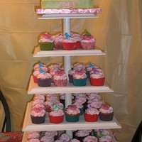 Abby Cadabby Cupcake Tower And Cake This was for my nieces 1st Birthday. My father in law makes the cupcake towers. The stand looks beautiful with a two tier wedding cake and...