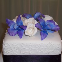 Blue Delrobium Orchids Gumpaste Blue Delrobium Orchids and White Roses. I loved these flowers when they were finished. They were made with a pale blue gumpaste...