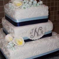 Calla Lilly And Feesia Sugar Calla Lillys and Freesia. Monogram and plate were done with cricut cake.