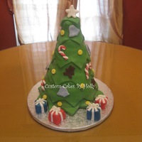 Christmas Tree Cake I made this for my Mother's Christmas Day Birthday! The presents are petit fours : )