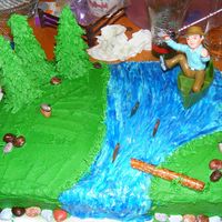 Fishing I made this cake for my dad's 50th b-day. It was red velvet cake, I used buttercream for all the icing. The rocks are candy.