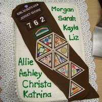Girl Scout Brownies Court Of Awards Cake Basic idea that turned out pretty cute. Buttercream frosting on the cake. The sash was made with fondant I colored brown. I attached the...
