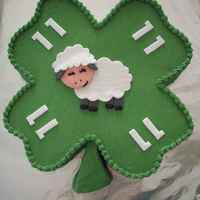 4-H Birthday Cake Shaped, buttercream iced cake with fondant decoration.