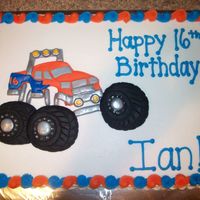 Monster Truck Cake Sheet cake, iced in buttercream with fondant decorations and buttercream border and writing.